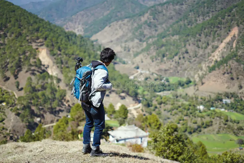 young-handsome-indian-boy-standing-top-mountain-bag-pack-traveling-wanderlust-187766813